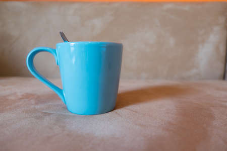 usual blue cup on sofaの写真素材