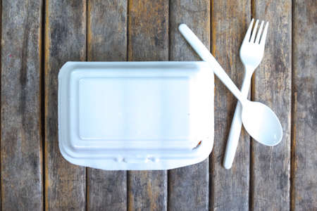 Empty styrofoam box on wood table