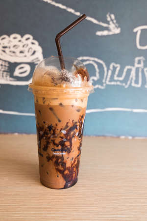 cup of ice coffee in take away plastic glass