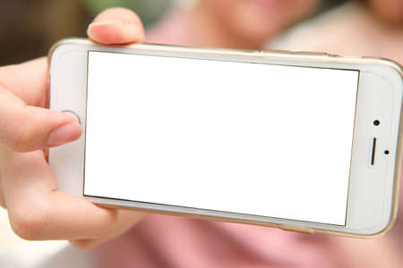 Hand holding taking selfie with mobile phone