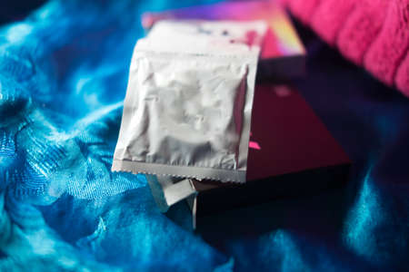 Condom packages on blue background