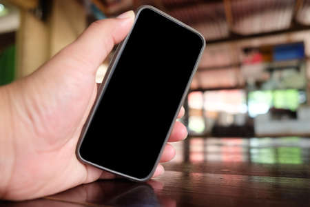 Man holding smartphone, black sceen
