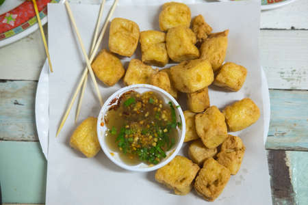 Fried Tofu - healthy food on wood table