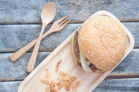 Homemade tasty sandwich with meat and vegetables on wood tableの写真素材