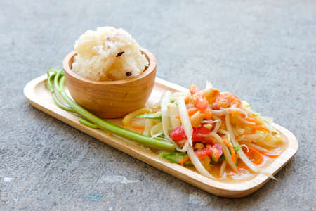 Papaya salad Thailand food call Som Tum Thai with sticky rice and  vegetables.の写真素材