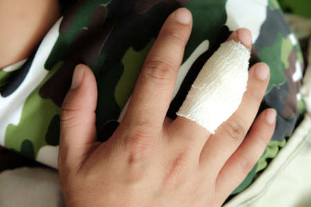 White medicine bandage on injured fingerの写真素材
