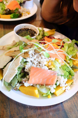 delicious smoked salmon salad with mixed vegetableの写真素材