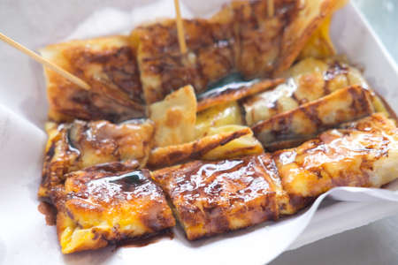 Fried Roti topping with chocolate fudge and banana insideの写真素材