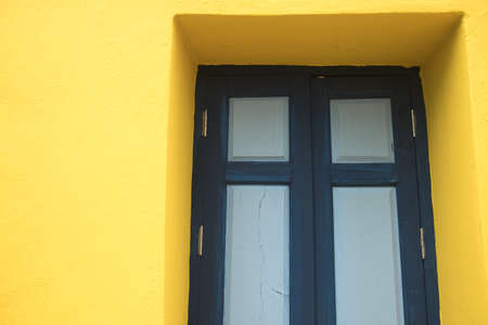 wood blue nice lovely window in yellow homeの写真素材