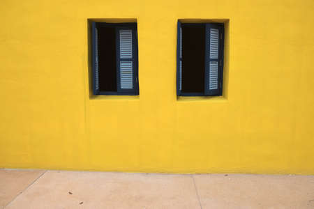 Classic wood window on cement wallの写真素材