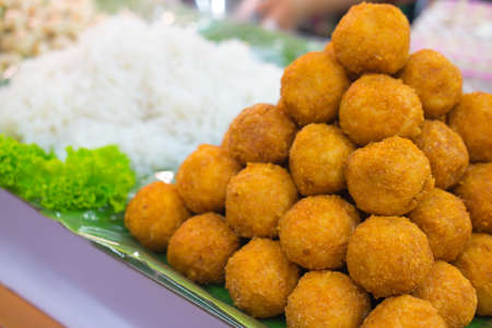 picy salad of curried rice croquettes with fermented pork (Yam Naem Khao Thod), Thailand style foodの写真素材