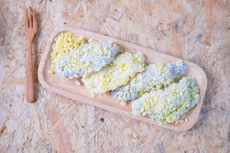 mung bean rice-crepe, mock bean pods, Thai dessert on wood trayの写真素材