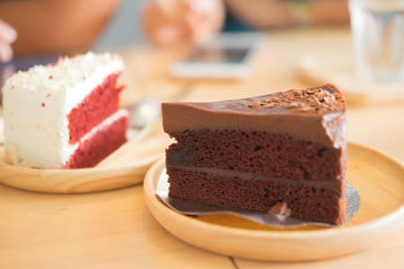 Close up Slice of chocolate cake on wood table