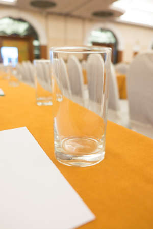 Empty glass of drinks water on table in seminar
