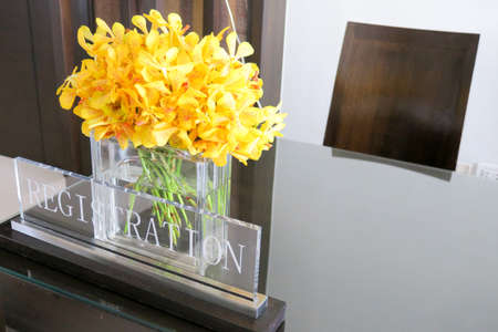 registration tag decoration by beautiful yellow orchidの写真素材