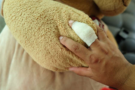 Finger injury with bandage. keep bearの写真素材
