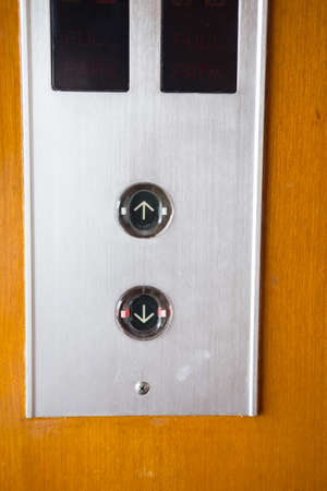 Elevator switch on the wood wallの写真素材