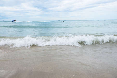 sea waves washing ashore at the beach, Thailandの写真素材