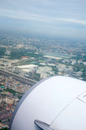 Classic image through aircraft window onto jet engine