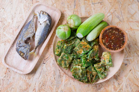 Fried mackerel with shrimp paste sauce, cha-om kai and vegetable set. Thai foodの写真素材