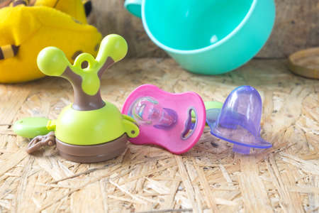 Baby accessories on wooden backgroundの写真素材