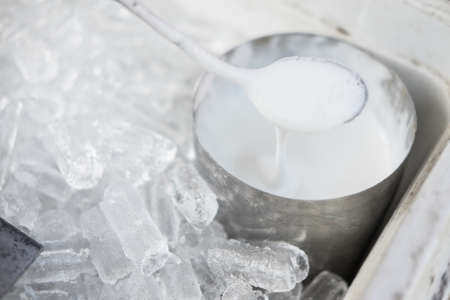 Milk being steamed for cappuccino or latte in a coffee shopの写真素材