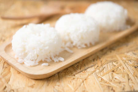 White steamed rice on wood trayの写真素材