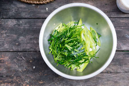 Slice of bergamot leaves and green hot chili pepper ready to cookの写真素材