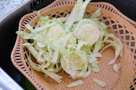 Fresh sliced green cabbage on basketの写真素材