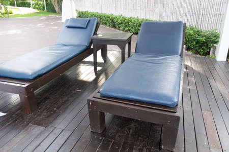 Beach chairs near swimming pool