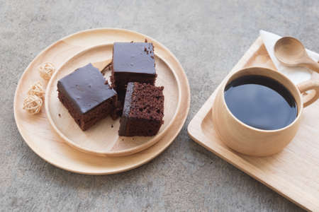 Homemade delicious chocolate cake served with hot coffeeの写真素材