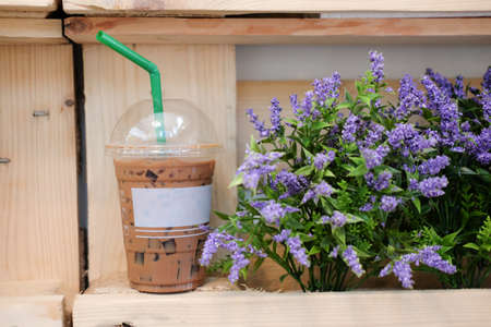 Iced coffee on wood table in coffee shopの写真素材