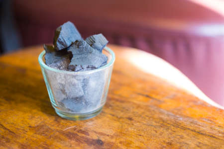 Charcoal arranged in a glass vase. Acts deodorizer which increase negative ions and purifies airの写真素材