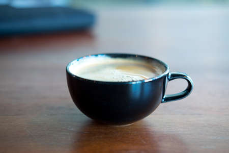 Hot black coffee in black cup afternoon break