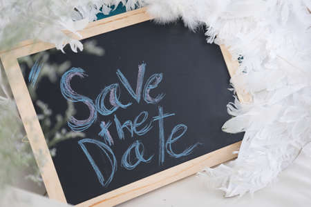 Sign With English Text Save The Date on blackboardの写真素材