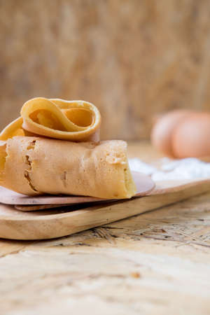 Thin flat pancake or crepe filled with sweet custard cream, Thai called Kanom Tokyoの写真素材