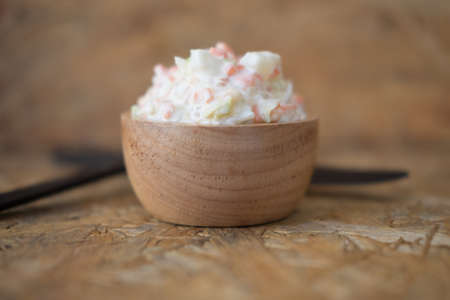 Wood bowl of delicious creamy homemade coleslawの写真素材