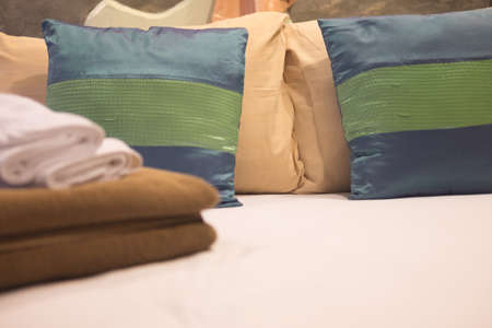 Bedroom with colorful cushions pillows on bedの写真素材