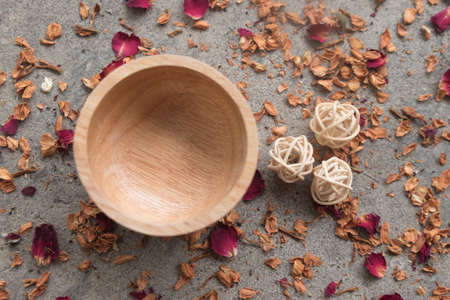 Wooden bowl on dried flower and rose petals driedの写真素材