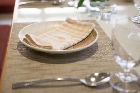 Empty glasses and dishes set in an empty interior new luxury restaurant