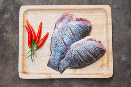Nile Tilapia fish with herbs ready to Thai cook