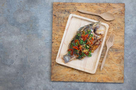 Tilapia fish fries topped with chili, Thai style menu