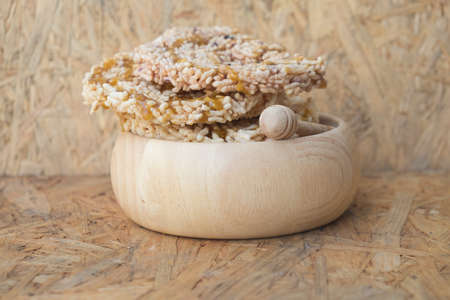 Thai sweet fried and pouring the sugar cane syrup on wood bowlの写真素材