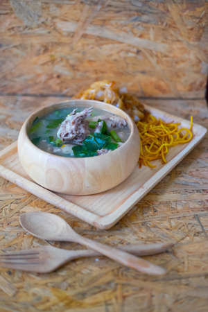 Wide noodles and crispy yellow noodle with in a creamy gravy sauce, in Thai language call is "Rad Na"の写真素材