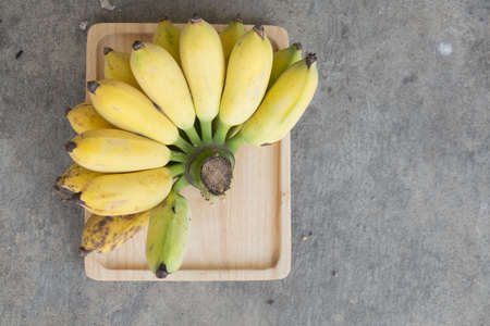 Close up yellow banana on wood trayの写真素材