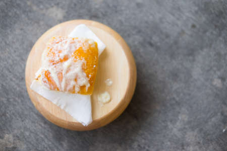 Toasted bread with butter and sprinkle with sugar on wood trayの写真素材