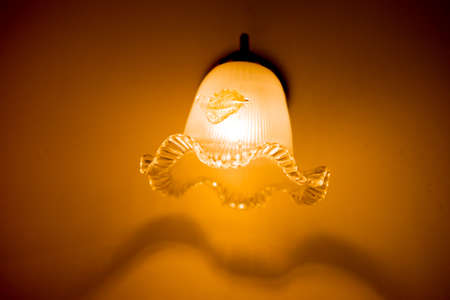 Ceiling lamp on wall in home at nightのeditorial素材