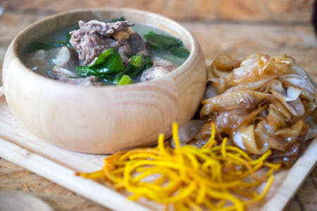 Wide noodles and crispy yellow noodle with in a creamy gravy sauce, in Thai language call is "Rad Na"の写真素材