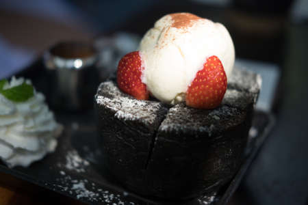 ice cream on black toast with strawberryblueberryの写真素材