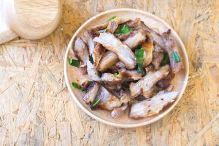 Grill neck pork in wooden dish on tableの写真素材